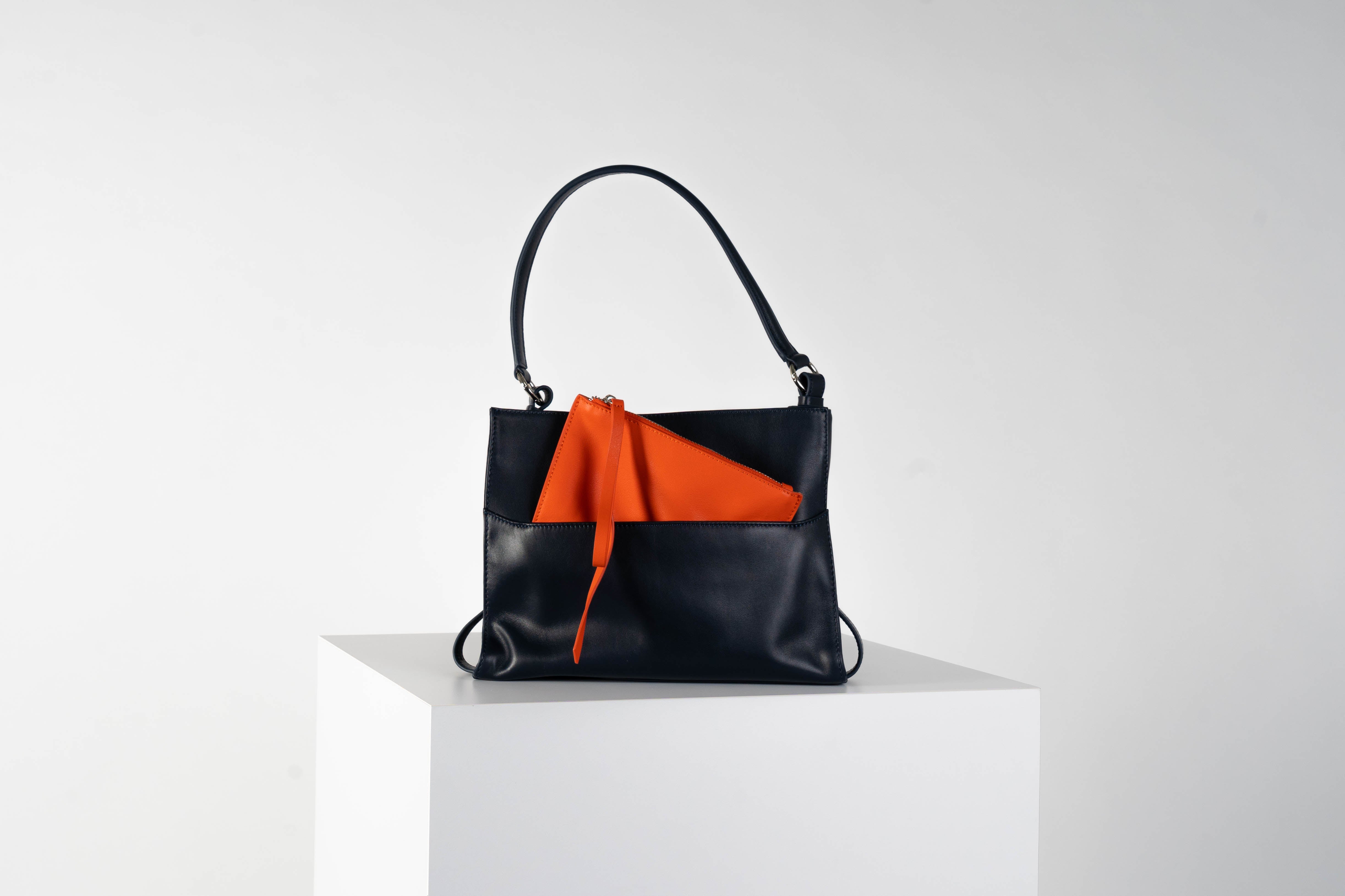 Leather shoulder bag In midnight blue with tangerine pouch