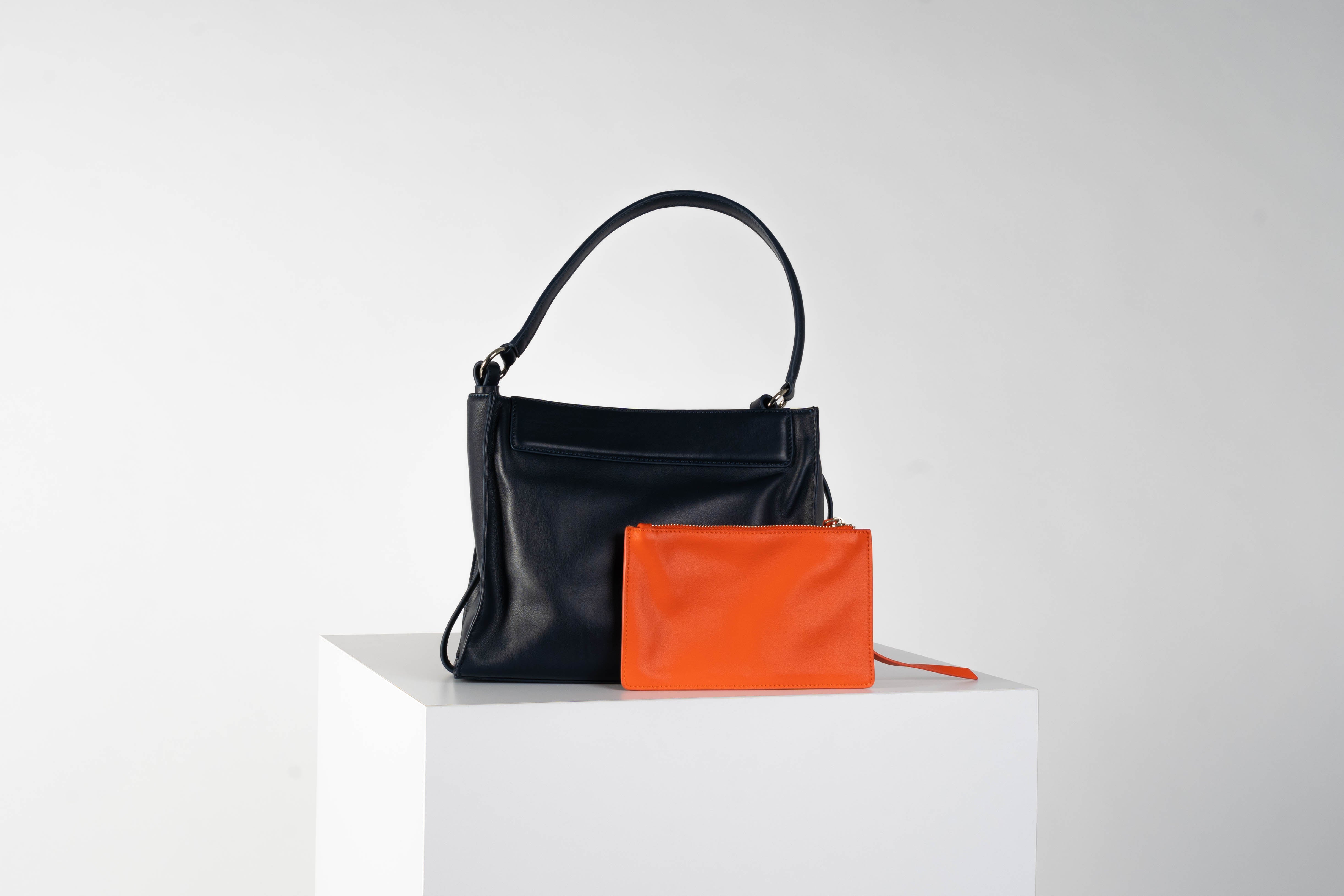 Leather shoulder bag In midnight blue with tangerine pouch